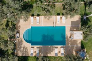 an overhead view of a house with a swimming pool at Nereides Luxury Villas in Kato Almiri