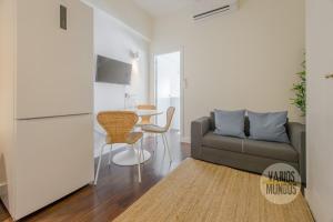 a living room with a couch and a table at New Loft 1hab 3px en plena Plaza de Chueca in Madrid