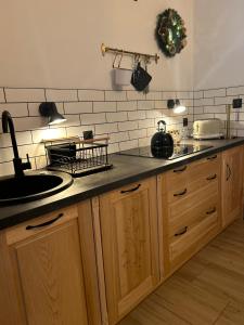 a kitchen with a sink and a counter top at Babcia Góralka house in Bukowina Tatrzańska