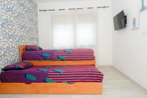 Giường trong phòng chung tại Luxe et confort absolu à Malabata TANGER