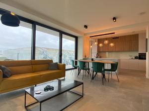 a living room with a couch and a table at Casa Aninka in Ostend