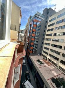 a view from a balcony of a city with buildings at Central Apt de 2hab para 5pax en Calle Silva in Madrid