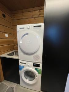a washer and dryer in a small room at Idre Mountain Lodges with 11 beds in Idre