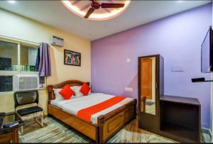 Кровать или кровати в номере Goroomgo Moon light Premium Bhubaneswar Luxury Collection