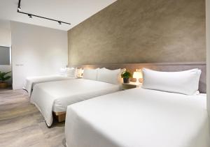 Letto o letti in una camera di Donggang Jingdi B&B