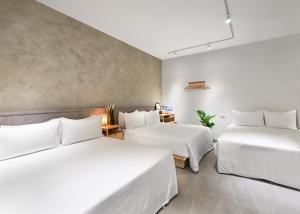 Letto o letti in una camera di Donggang Jingdi B&B