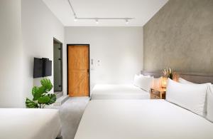 Letto o letti in una camera di Donggang Jingdi B&B