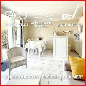a room with a table and chairs and a kitchen at "MOULIN VERT RIVAGE" Maison, 6 personnes, au coeur du golf, village vacances, accès piscines gratuit in Talmont