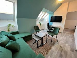 a living room with a couch and chairs and a piano at Elegant 2+1 BR Apt at Vienna's Vibrant 3. District in Vienna