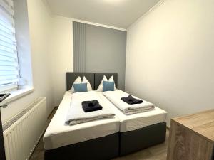 Postel nebo postele na pokoji v ubytování Berzsenyi Apartmanház