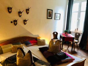 a bedroom with a bed with antlers on the wall at Jägerwohnung in Süderholz