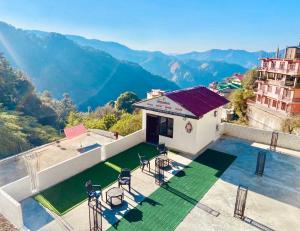 a villa with a view of the mountains at The Regency by Boho Stays in Shimla