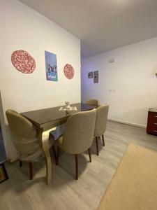 a dining room with a table and chairs at Rehab serenity in Cairo