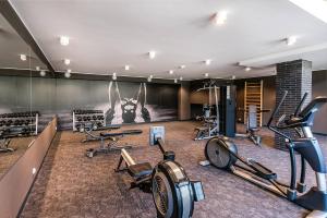a gym with treadmills and exercise equipment in a room at Klif Apartamenty Nadmorskie Tarasy A202 in Kołobrzeg