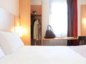 Postel nebo postele na pokoji v ubytování ibis Limoges Centre