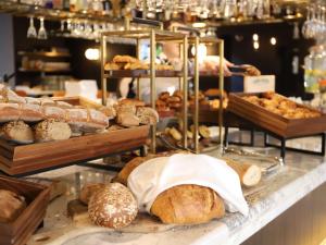 a bakery with many different types of bread and pastries at Sofitel Legend The Grand Amsterdam in Amsterdam