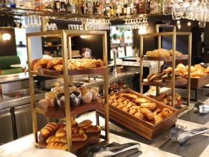 a display of different types of pastries in a bakery at Sofitel Legend The Grand Amsterdam in Amsterdam