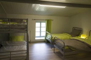 Postel nebo postele na pokoji v ubytování Gîte écologique 14 pers. à Taverneux - Houffalize