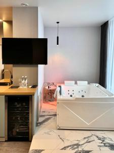 Posteľ alebo postele v izbe v ubytovaní Be The One Hotel