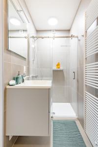 a bathroom with a shower and a sink at The Hadewijch - room nearby centre Bruges in Bruges