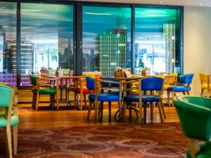 a restaurant with tables and chairs and a view of the city at LEGOLAND(R) Windsor Resort in Windsor