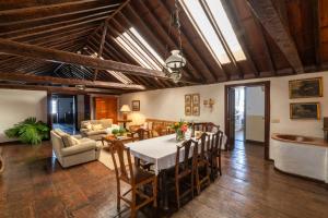a dining room with a table and chairs at Finca San Diego with Pool & Wifi in La Matanza de Acentejo