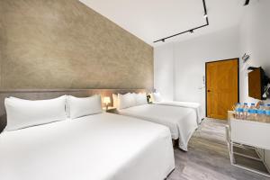 Letto o letti in una camera di Donggang Jingdi B&B