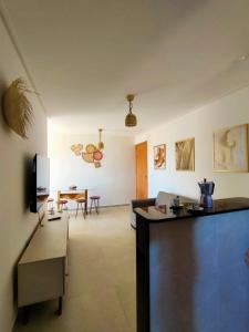 a living room with a couch and a table at Nice apartment Bessa beach in João Pessoa
