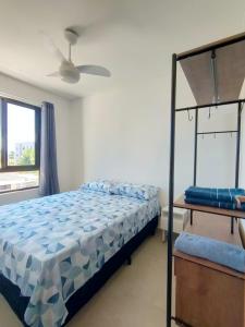a bedroom with a bed and a bunk bed at Nice apartment Bessa beach in João Pessoa