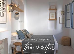 a bedroom with a bed with a sign that says the kitchen at Arta Hydra in Hydra