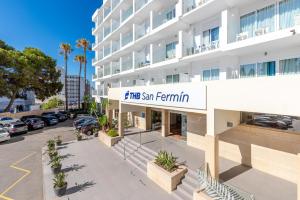 an apartment building with a sign for the san ignacio community at THB San Fermín in Benalmádena