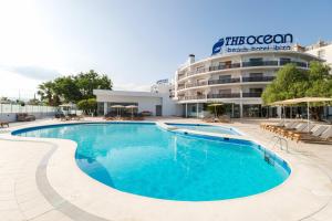 a large swimming pool in front of a hotel at THB Ocean Beach in San Antonio Bay