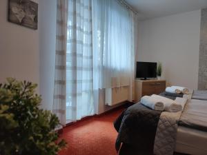 Posteľ alebo postele v izbe v ubytovaní DW Agat