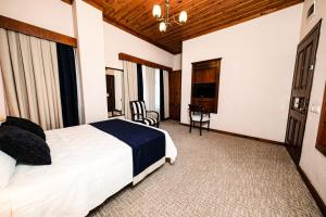 Postel nebo postele na pokoji v ubytování Hotel Bosnali