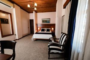 Postel nebo postele na pokoji v ubytování Hotel Bosnali