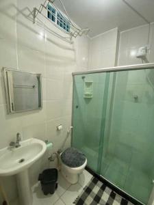 a bathroom with a shower and a toilet and a sink at Residencial -Copacabana -Praia in Rio de Janeiro