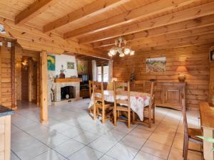 a dining room with a table and chairs in a cabin at Spacious Chalet in Abbevillers with Swimming Pool in Abbévillers