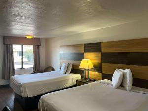 Säng eller sängar i ett rum på Motel 6 Cross Lanes, WV Goff Mountain Rd