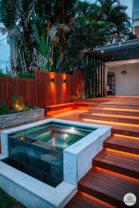a swimming pool in the middle of a deck with stairs at Ti Kaz Bellevue - villa avec vue mer - jacuzzi - Saint-Denis in Saint-Denis