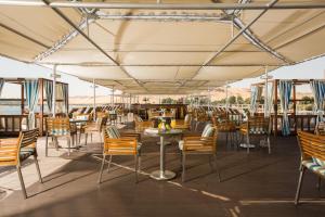 a restaurant with chairs and tables under a tent at M/Y ALYSSA - 4 or 7 Nights From Luxor each Monday and 3 or 7 Nights From Aswan each Friday in Luxor