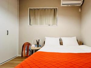 Postel nebo postele na pokoji v ubytování JoyHome 天下茶屋駅7分4LDK一軒家 難波梅田黒門関空直通 無料駐車場