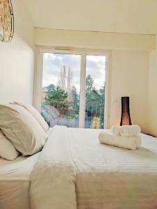 En eller flere senge i et værelse på Métro à 2 minutes Paris centre le Marais