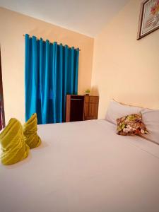 Indino Guesthouse tesisinde bir odada yatak veya yataklar