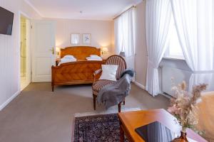 Postel nebo postele na pokoji v ubytování Romantik Hotel Zehntkeller