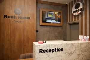 a reception area of a hotel with a reception desk at Rush Hotel Tokat in Tokat