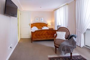 Postel nebo postele na pokoji v ubytování Romantik Hotel Zehntkeller