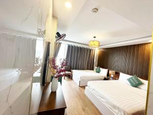 Postel nebo postele na pokoji v ubytování ACE Hotel - Bến Thành