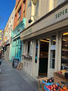 a street with a store with fruits and vegetables at Superb 2Bed/2Bath Flat Waterloo London in London