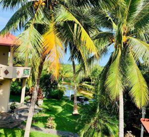 a view of a resort with palm trees at Shangri-lanka Villa in Bentota