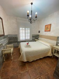 A bed or beds in a room at Casas Guemon